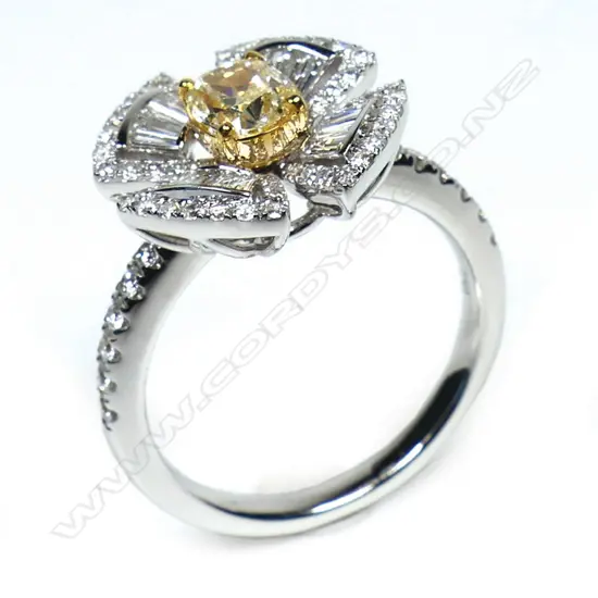 An 18ct white gold yellow and white diamond ring,