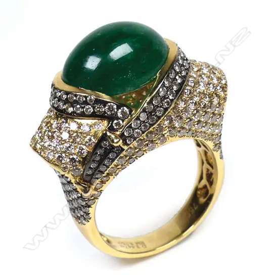 An 18ct gold emerald and diamond ring,