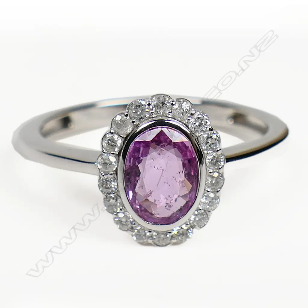 A 14ct white gold pink sapphire and diamond vintage style halo ring, Image 1++