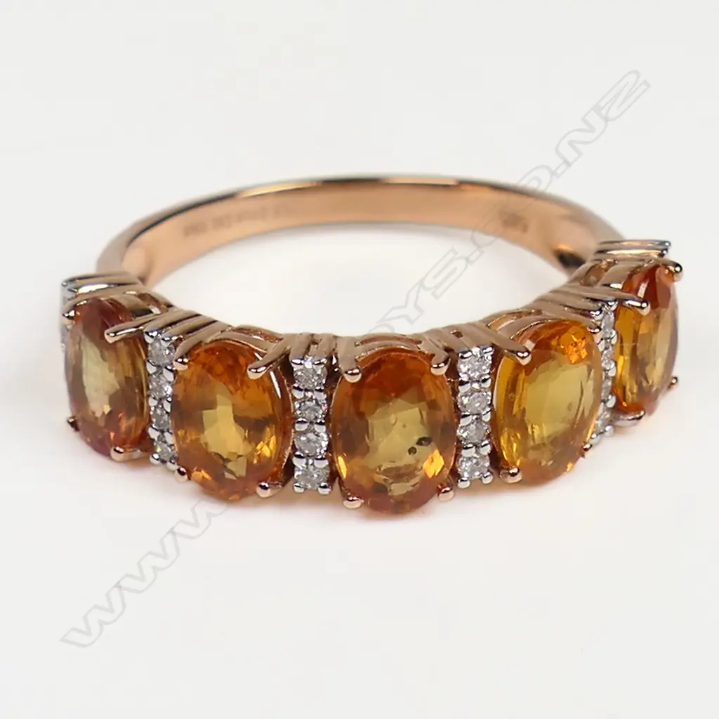 A 14ct gold orange sapphire and diamond eternity band, Image 1++