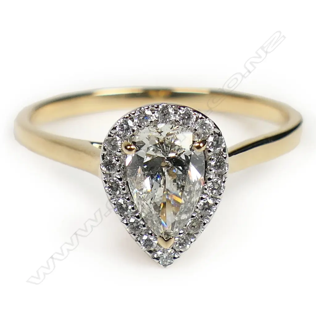 A 14ct gold diamond halo ring, Image 1++