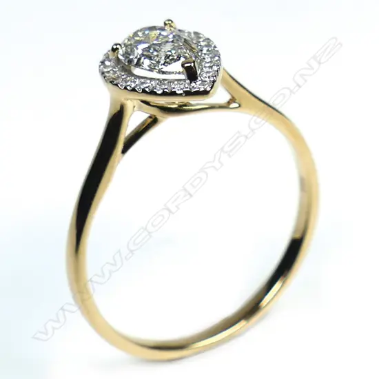 A 14ct gold diamond halo ring,