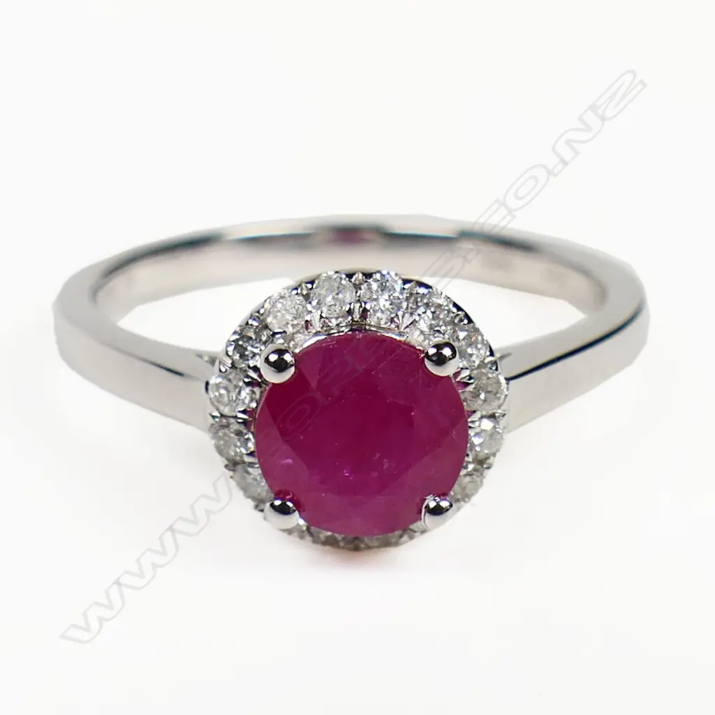 A 14ct white gold ruby and diamond halo ring, Image 1++