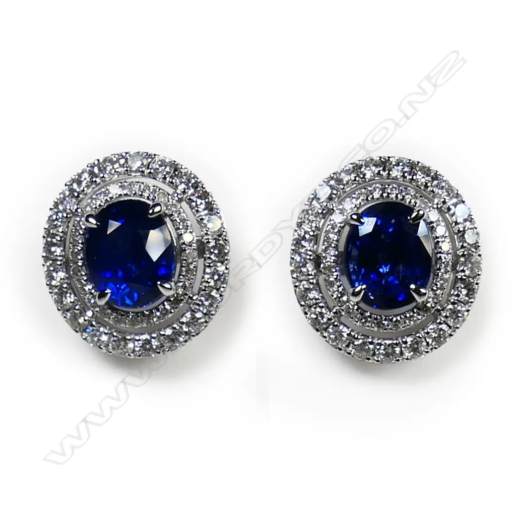 A pair of 18ct white gold sapphire and diamond double halo earrings, Image 1++