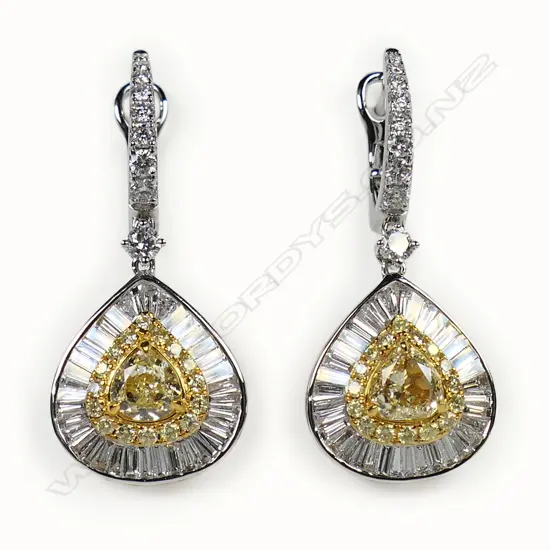 A pair of 18ct white gold yellow and white diamond earrings,