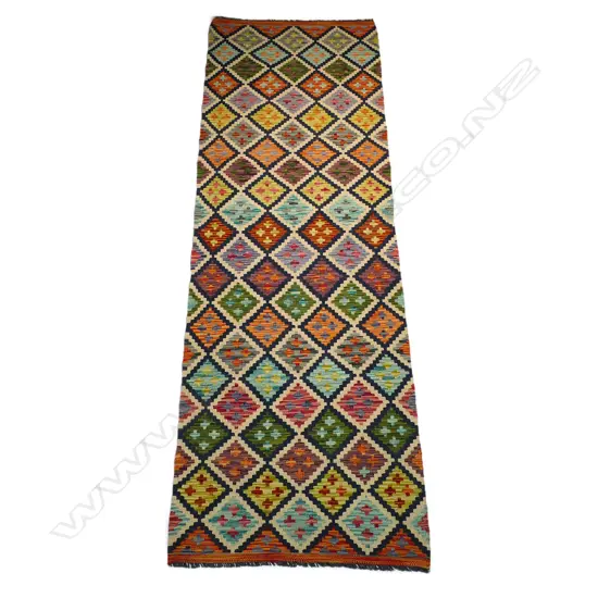 A hand-woven kilim runner,