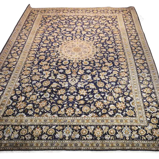 A fine large hand-knotted Kashan carpet,