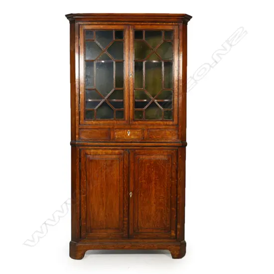 A Georgian oak free standing corner cabinet,