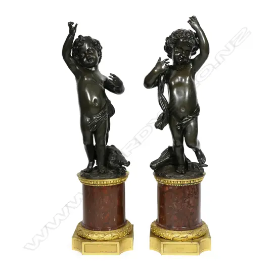 A pair of impressive French 19thC bronze and marble cherub sculptures,
