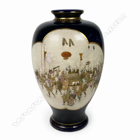 A Japanese Meiji period fine Satsuma vase - with two lobed cartouches, one including processional figures, the reverse with birds in a flowering branch. Gilt highlights. Gilt marks to base. H.210mm.