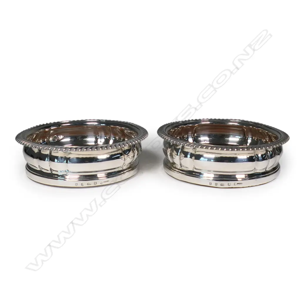 A pair of rare and impressive large silver champagne bottle coasters, Image 1++