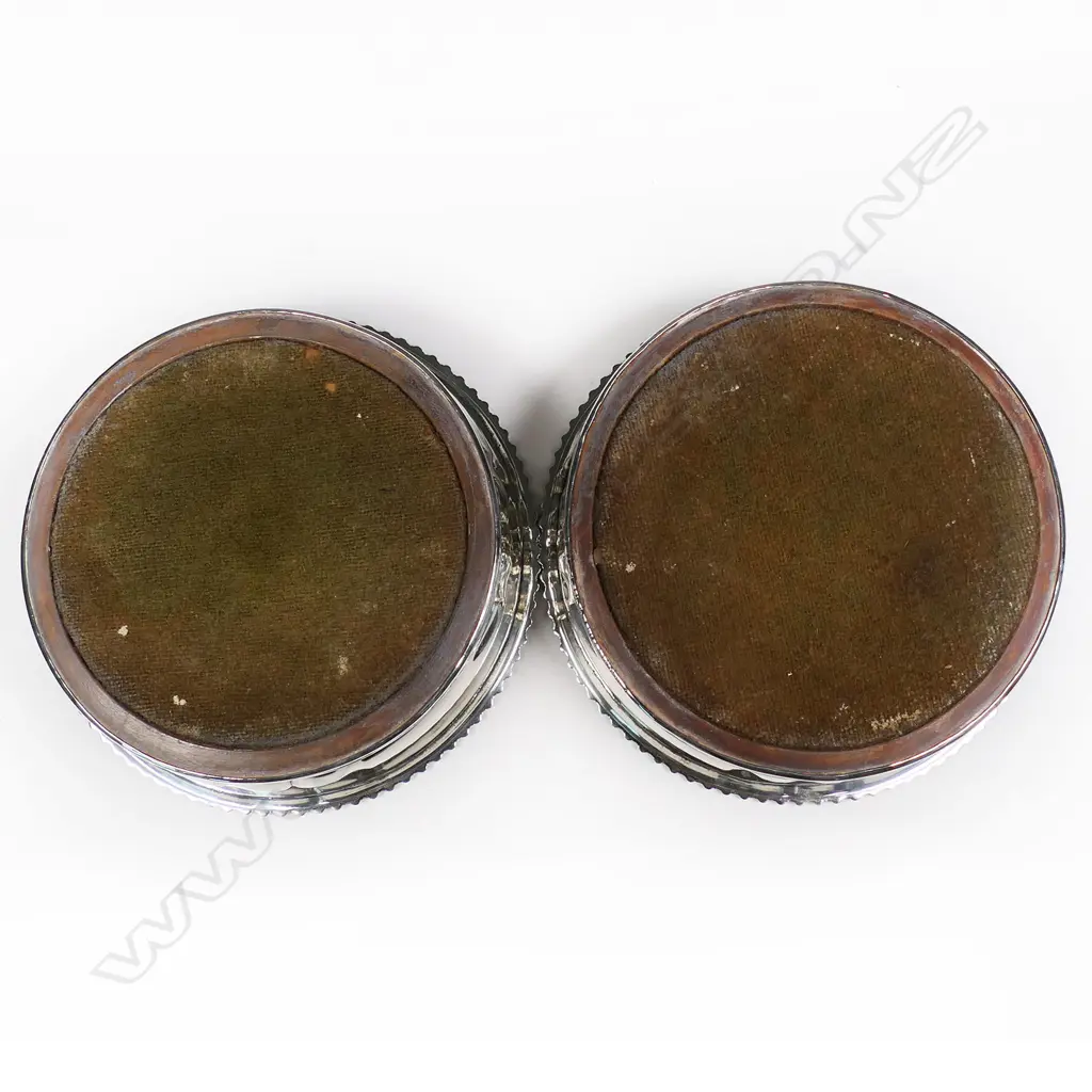 A pair of rare and impressive large silver champagne bottle coasters, Image 1++