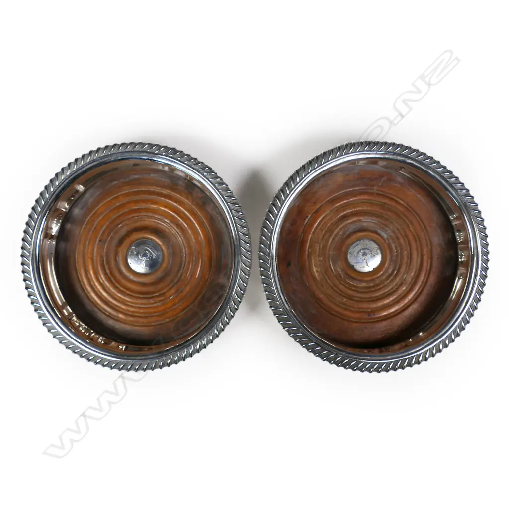 A pair of rare and impressive large silver champagne bottle coasters, Image 1++