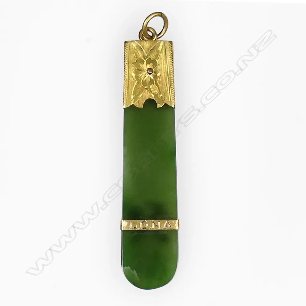 A c.1900 gilded gold and pounamu mining themed pendant, Image 1++