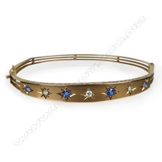 An Edwardian 9ct rose gold hinged bangle,