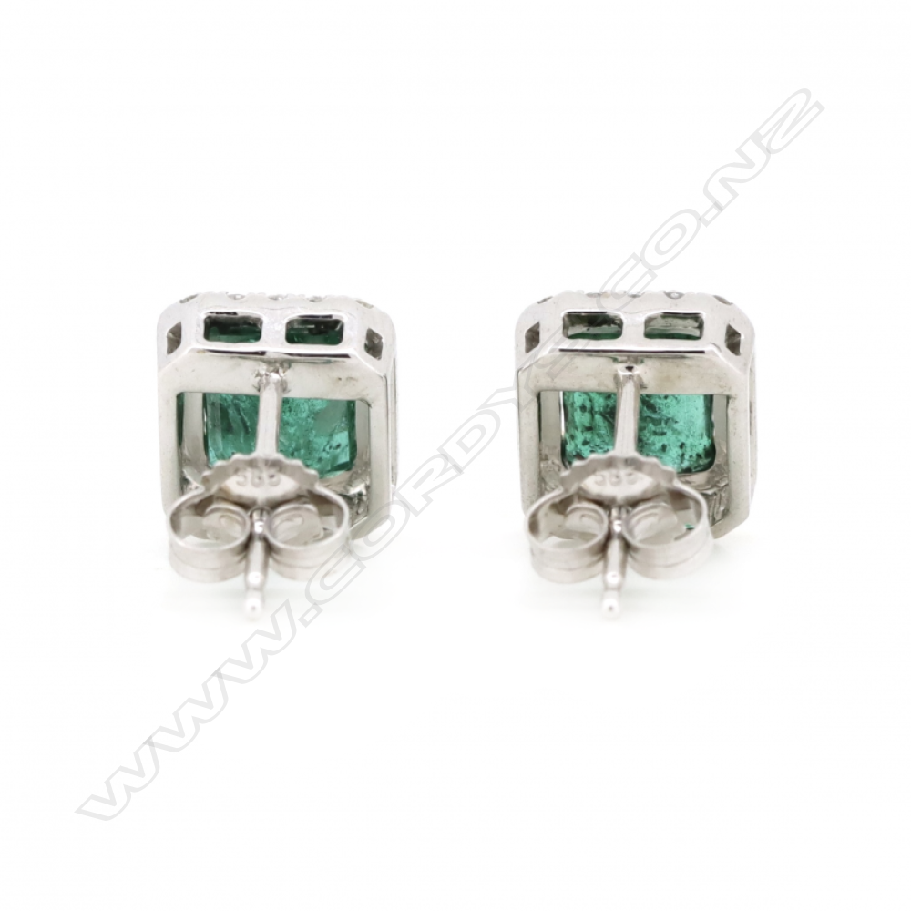 A pair of 14ct white gold emerald and diamond halo stud earrings, Image 1++