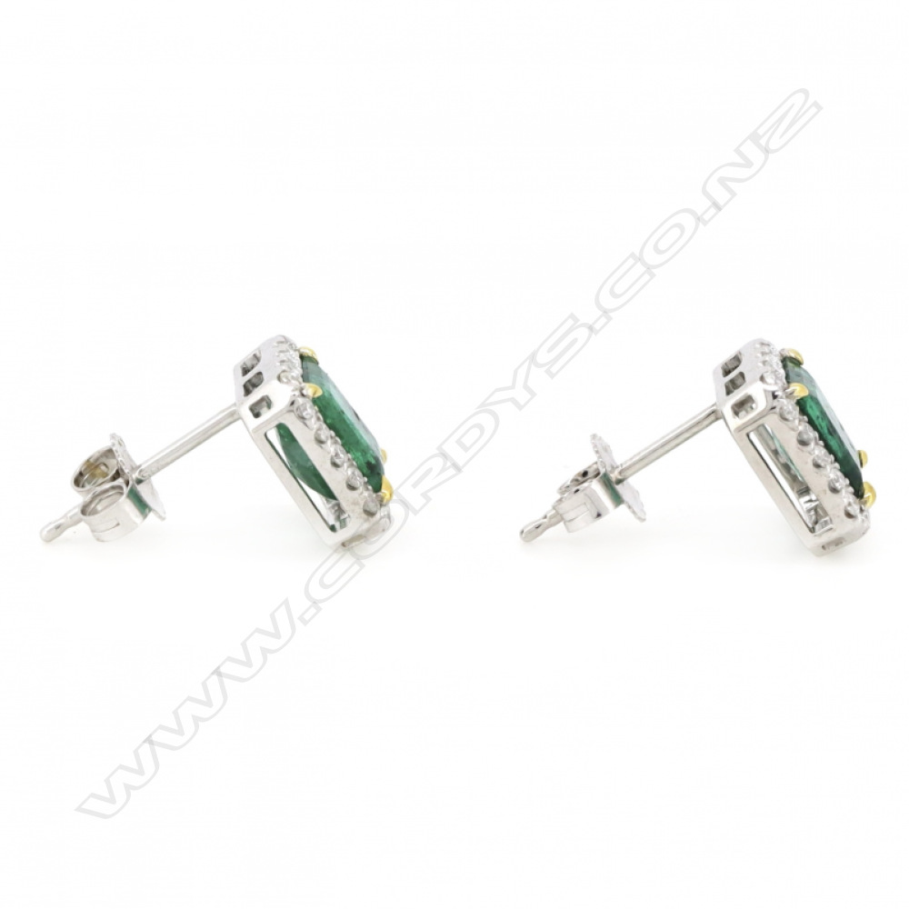A pair of 14ct white gold emerald and diamond halo stud earrings, Image 1++