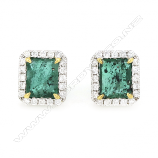 A pair of 14ct white gold emerald and diamond halo stud earrings,