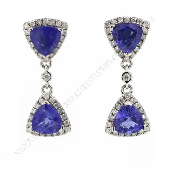 A pair of 14ct white gold tanzanite and diamond double halo drop earrings,