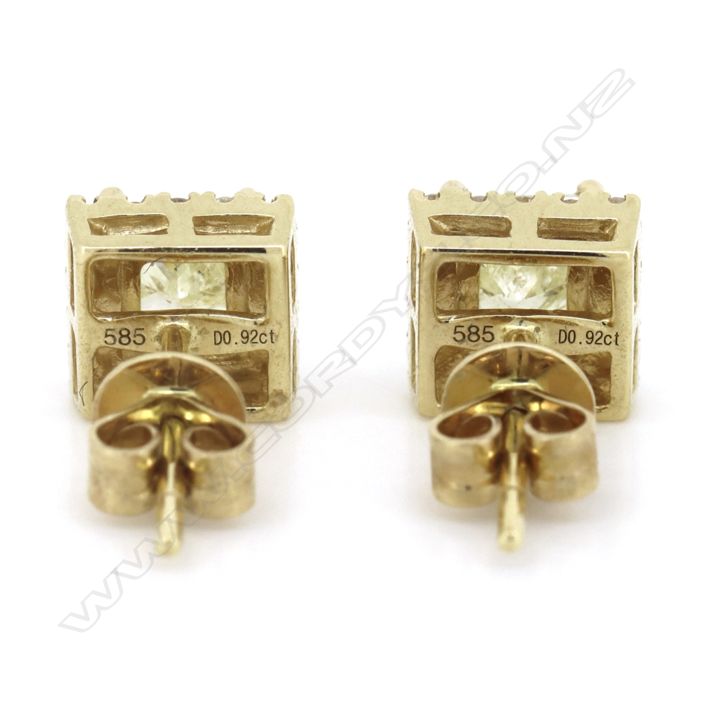 A pair of 14ct gold yellow diamond halo stud earrings, Image 1++