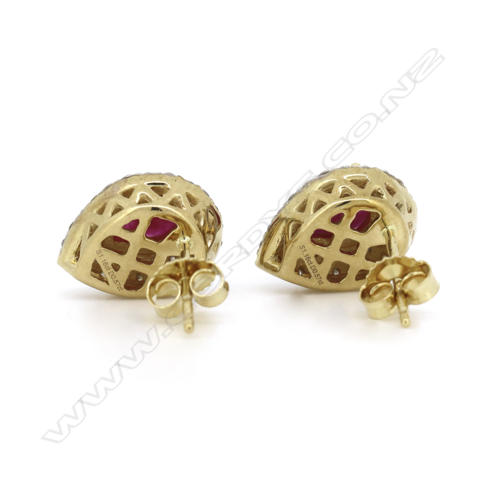 A pair of 14ct gold ruby and diamond double halo stud earrings, Image 1++