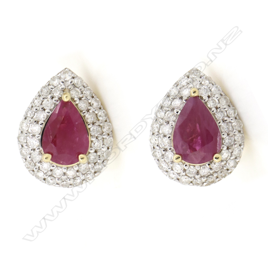 A pair of 14ct gold ruby and diamond double halo stud earrings, Image 1++