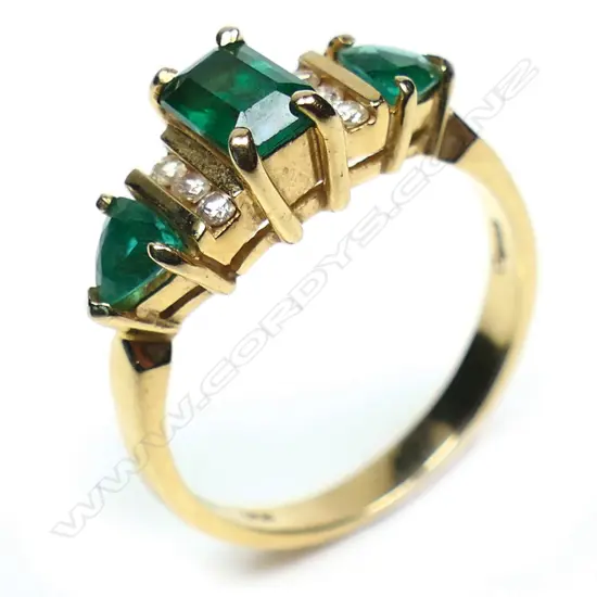 A 14ct created emerald and diamond ring,