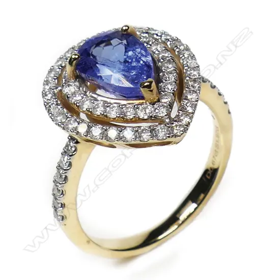 A 14ct gold tanzanite and diamond double halo ring,