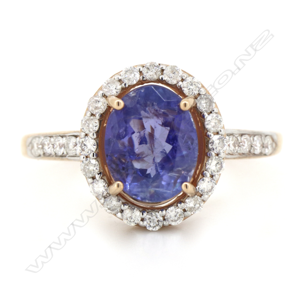 A 14ct rose gold tanzanite and diamond halo ring, Image 1++