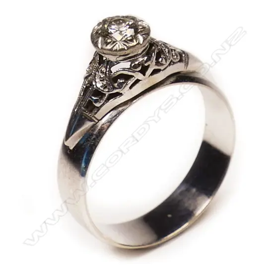 A 9ct gold and diamond solitaire ring,