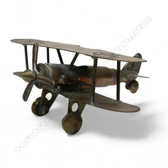 An old brass trench art bi-plane,