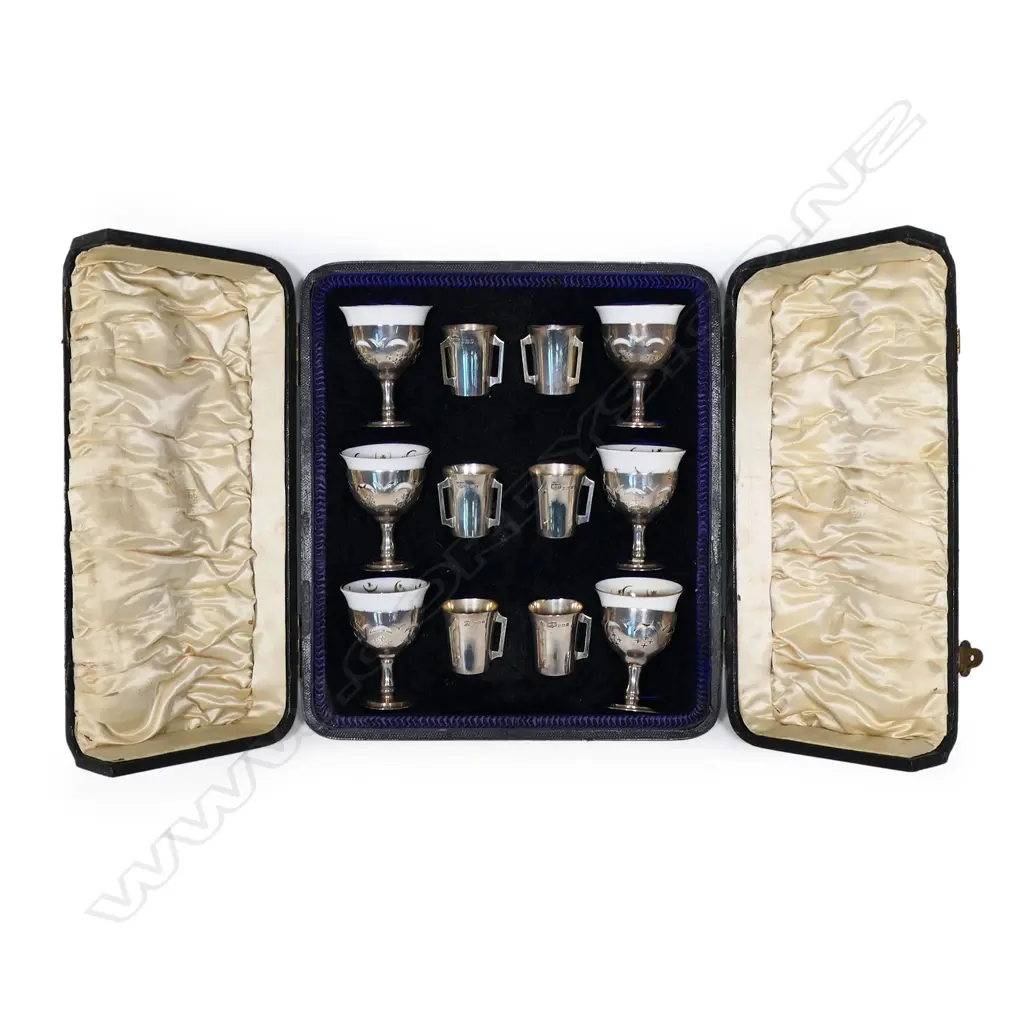 An Edwardian cased set of silver and porcelain coffee zarfs and liquor cups, Image 1++