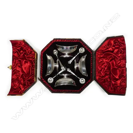 A Victorian set of four silver pedestal salts with spoons in box,