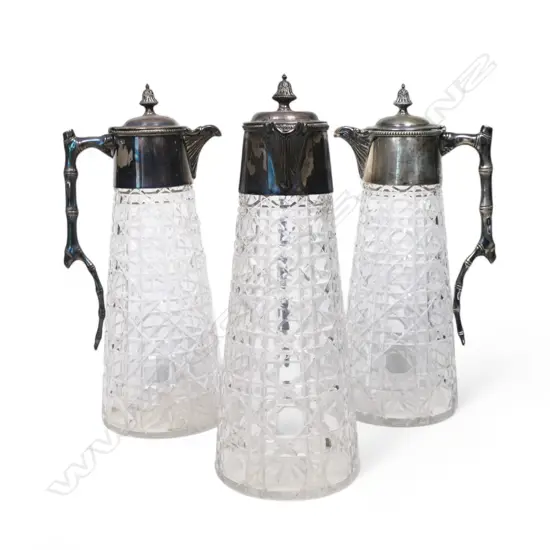 Three crystal and silver claret jugs,
