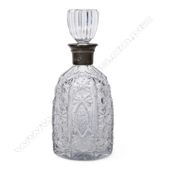A crystal and silver decanter