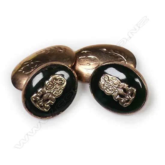 A pair of c.1900 pounamu and 9ct gold tiki cufflinks,