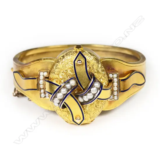 An impressive Victorian 15ct gilded rose gold ornate mourning hinged bangle with locket,