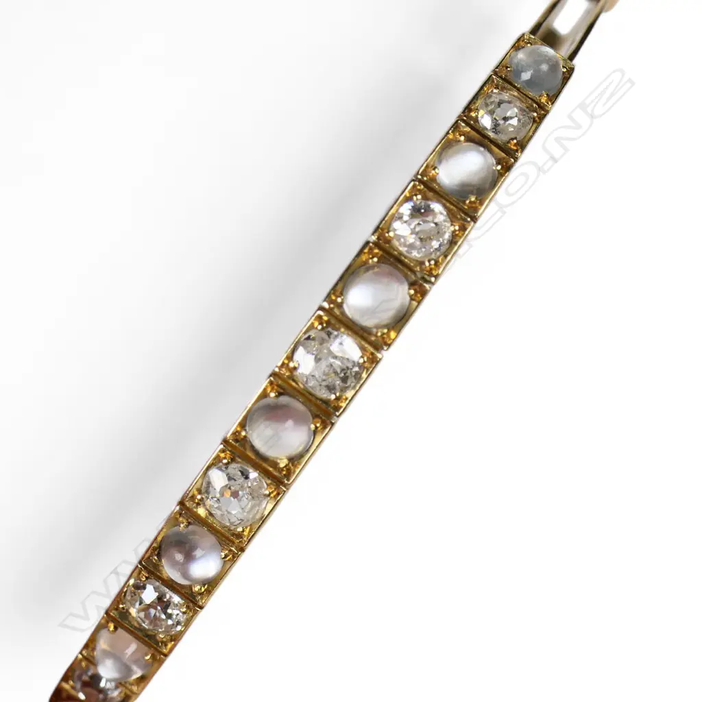 A 15ct rose gold moonstone and diamond hinged bangle, Image 1++