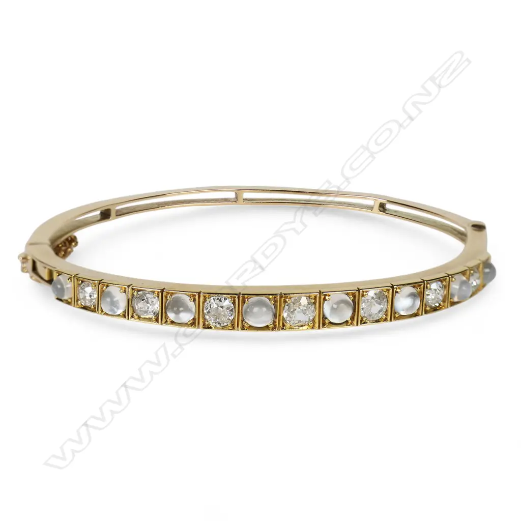 A 15ct rose gold moonstone and diamond hinged bangle, Image 1++