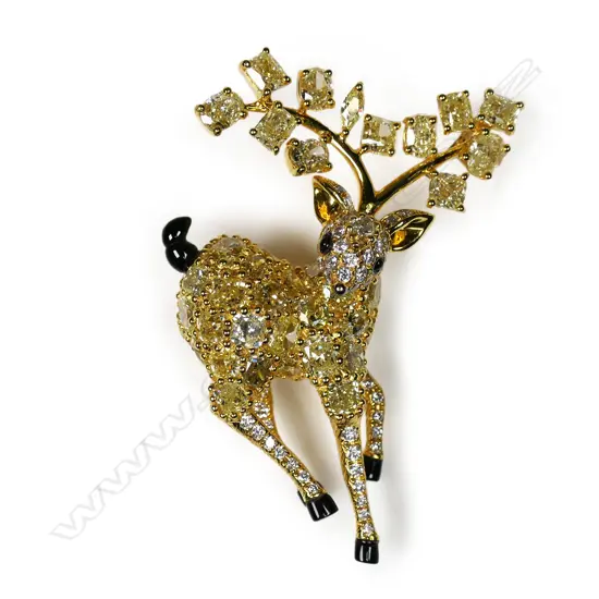An 18ct gold and diamond deer pendant/brooch,