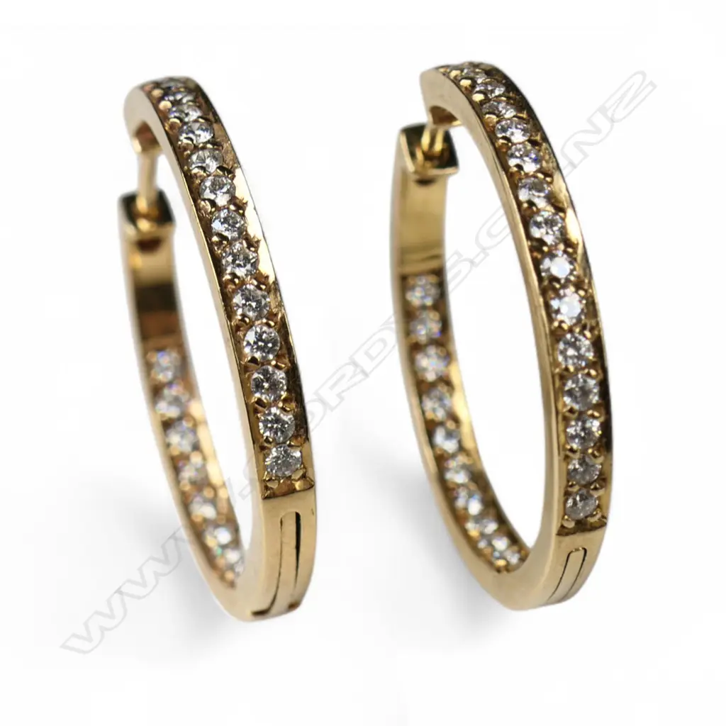 A pair of 18ct gold and diamond hoop earrings, Image 1++