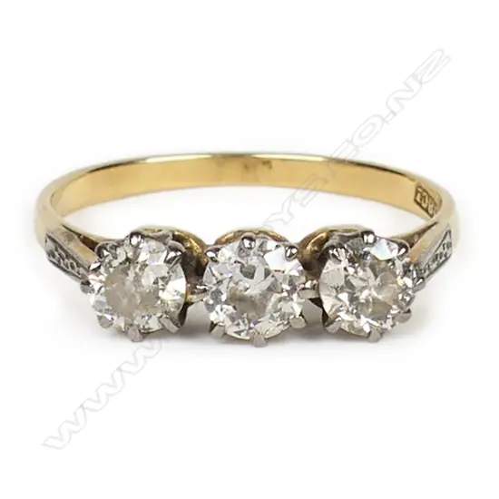 An estate 18ct gold and three stone diamond ring,
