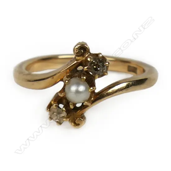 An estate 18ct gold diamond and pearl ring,
