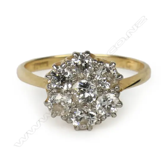 An estate 18ct gold and diamond cluster ring,