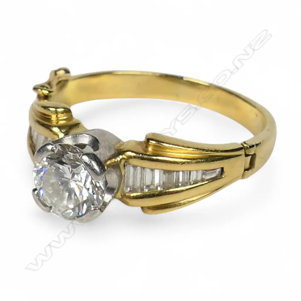 An 18ct gold and diamond solitaire ring, Image 1++