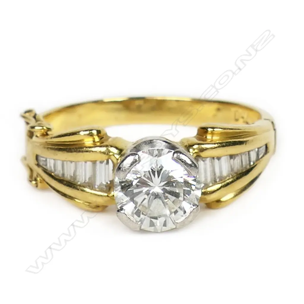 An 18ct gold and diamond solitaire ring, Image 1++