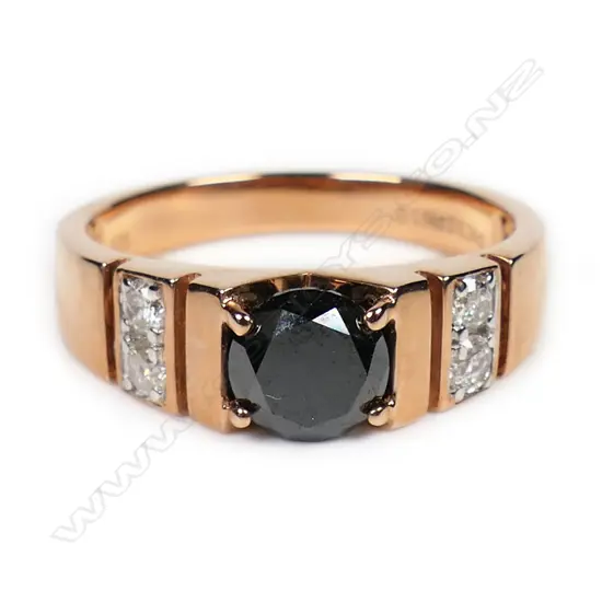 A 14ct rose gold black and white diamond ring,