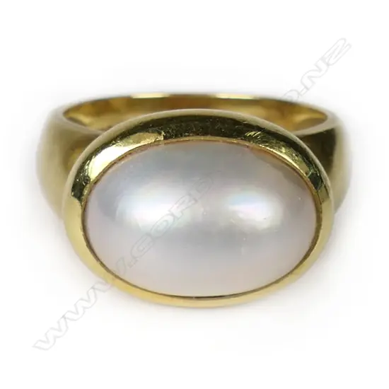 An 18ct yellow gold and half mabé pearl designer ring,