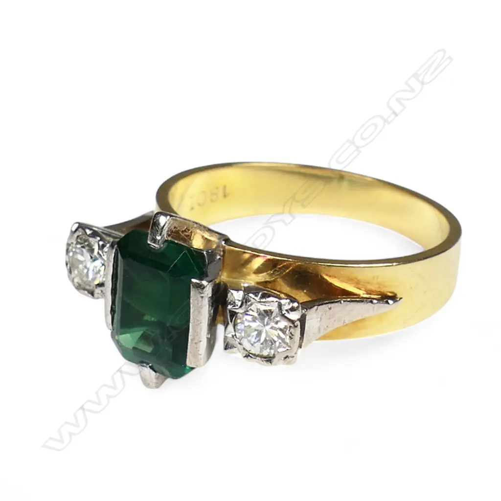 An 18ct yellow and white gold synthetic emerald and diamond three stone ring, Image 1++