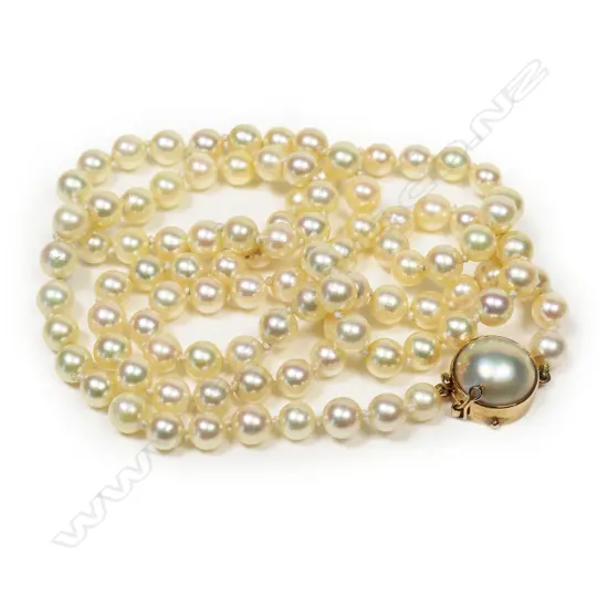 A long strand of uniform Akoya cultured pearls,